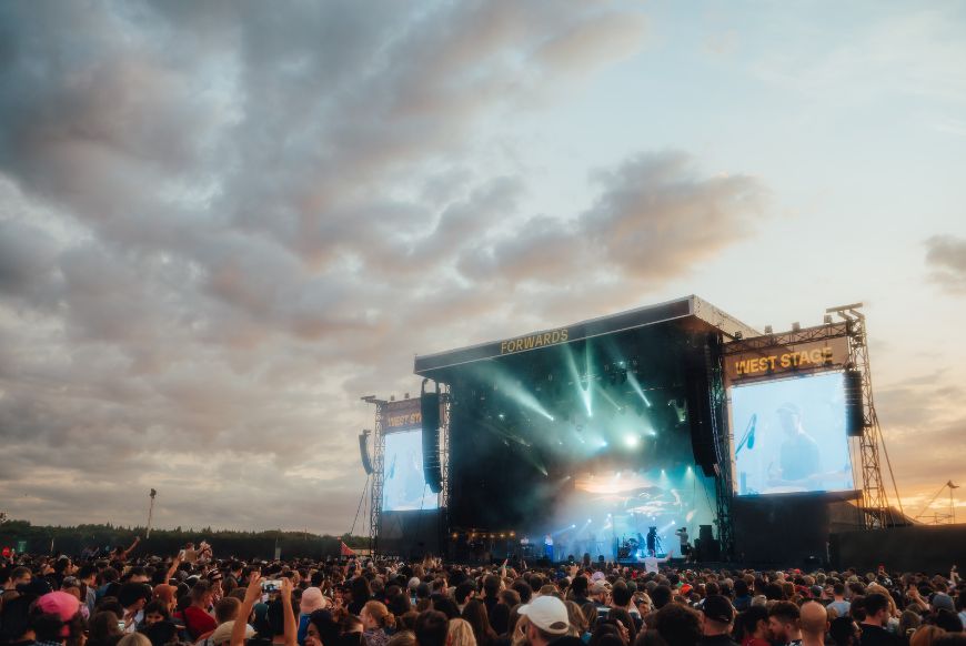 a big stage, with a crowd of people around it